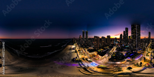 Surfers Paradise After Hours: Capturing the Enchanting Nightlife in a 360 Aerial Shot of Dark Downtown Buildings against the Beach