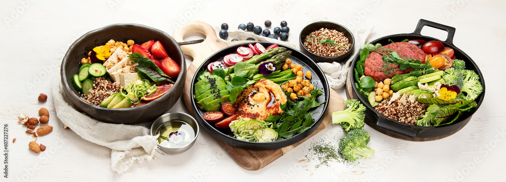 Healthy vegetarian and vegan salads and Buddha Bowls with vitamins, antioxidants, protein on light background. Healthy vegetarian and vegan salads and Buddha Bowls with vitamins, antioxidants, protein on light background.
