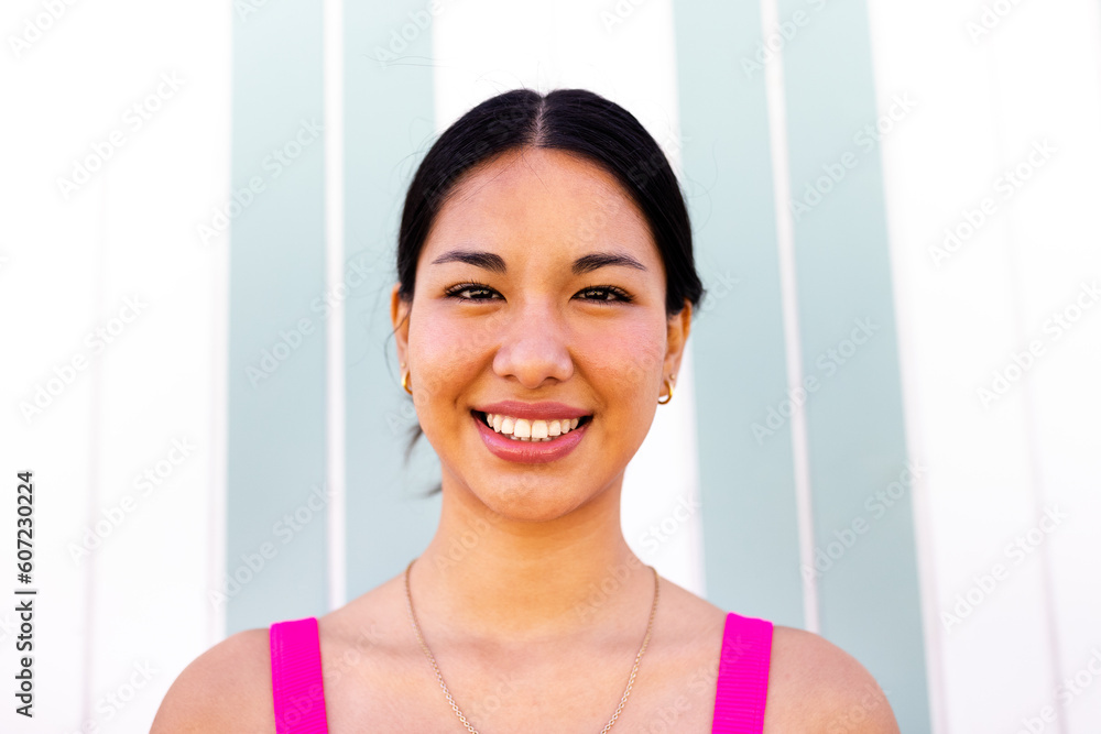 Headshot of young happy latina woman on summer vacation looking at camera. Headshot of young happy latina woman on summer vacation looking at camera.