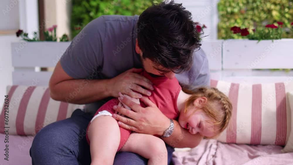 Father having fun with little baby girl in sunny living room with patio, playing with daughter at home, family games Father having fun with little baby girl in sunny living room with patio, playing with daughter at home, family games