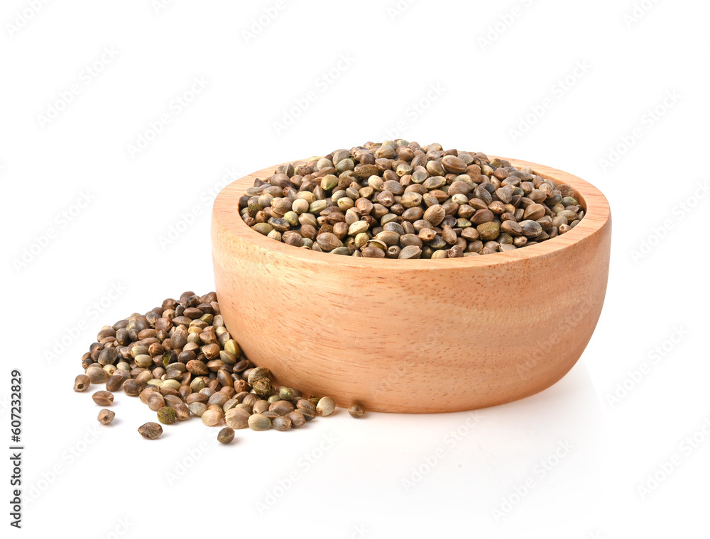 hemp seeds in wooden bowl on white background. hemp seeds in wooden bowl on white background.
