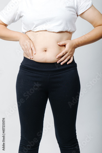 Women with abdominal fat, obesity problems, fat accumulation, diet, exercise, weight loss, postpartum women's abdomen fat accumulation after giving birth