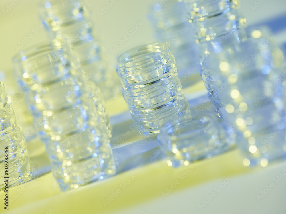 arrangement of yellow and blue transparent containers arrangement of yellow and blue transparent containers