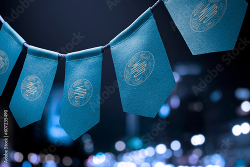 A garland of International Intellectual Property Organization national flags on an abstract blurred background photo