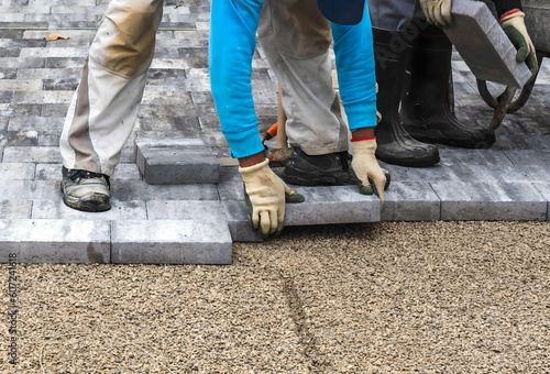  paving blocks. worker are installing paving blocks  © mirsad