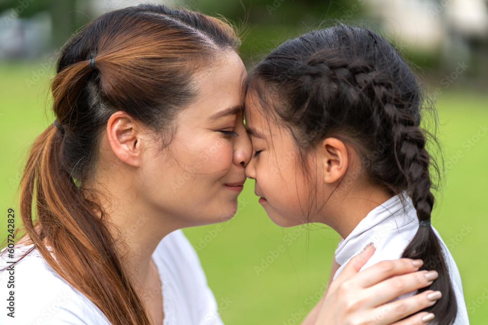 Portrait of enjoy happy love asian family mature mother and girl daughter smiling play and having fun together, mom, mother day, care, kid, child.happy family in moments good time at home Portrait of enjoy happy love asian family mature mother and girl daughter smiling play and having fun together, mom, mother day, care, kid, child.happy family in moments good time at home