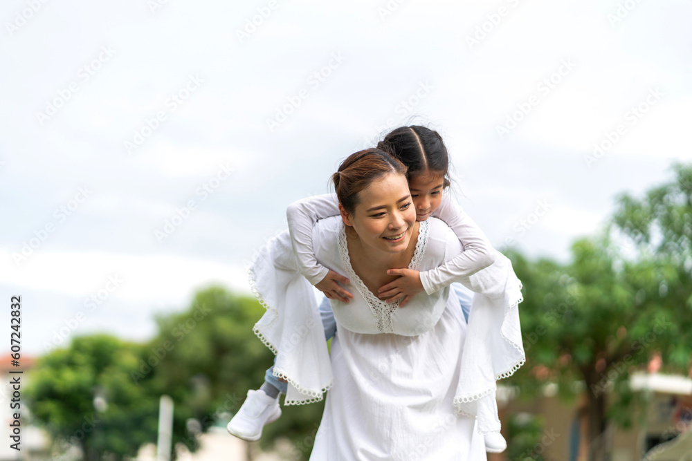 Portrait of enjoy happy love asian family mature mother and girl daughter smiling play and having fun together, mom, mother day, care, kid, child.happy family in moments good time at home Portrait of enjoy happy love asian family mature mother and girl daughter smiling play and having fun together, mom, mother day, care, kid, child.happy family in moments good time at home