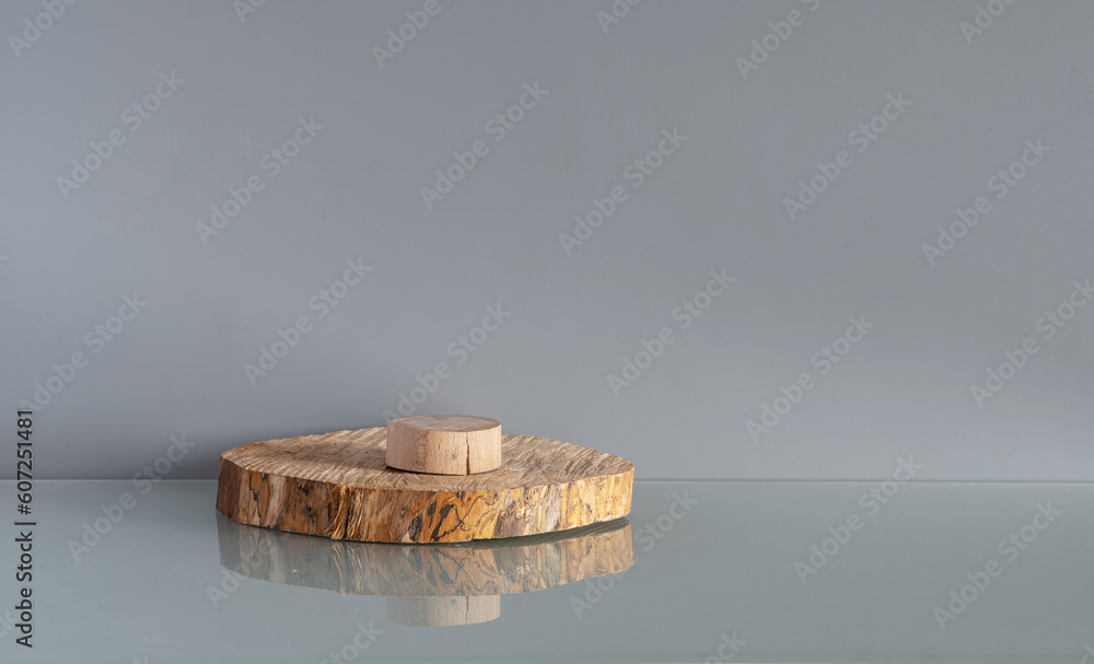 Tree slice or podium. Product display on a gray background. Mockup for product branding, presentation. Background for products, cosmetics, jewelry.