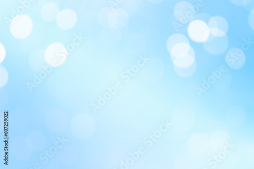 Beautiful White Bokeh Light De-focused A Blue Abstract Background. Celebration Festive, Circles Blurred White Space. 