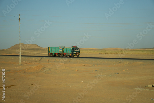 Camion con rimorchio dai colori vivaci, in mezzo al deserto egiziano photo
