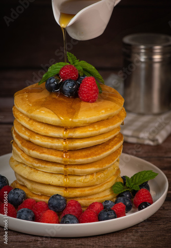 Recipe for maple syrup pancakes with raspberry and blueberry filling, High quality photo
