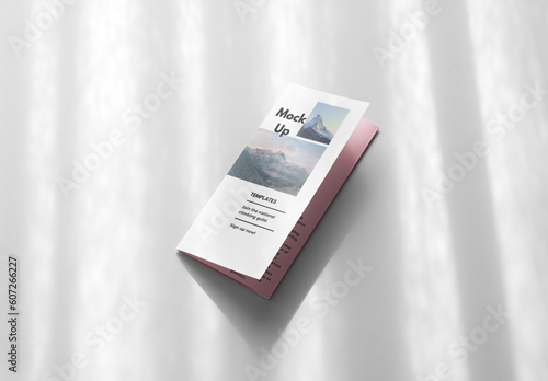 Mockup of customizable A4 bi-fold closed leaflet against customizable background