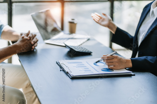 startup business, business advisor leadership for planning finance investment teamwork paperwork audit and discussing marketing, profit, budget of company in meeting room.