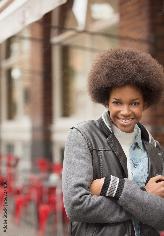 Fototapeta premium Woman smiling on city street