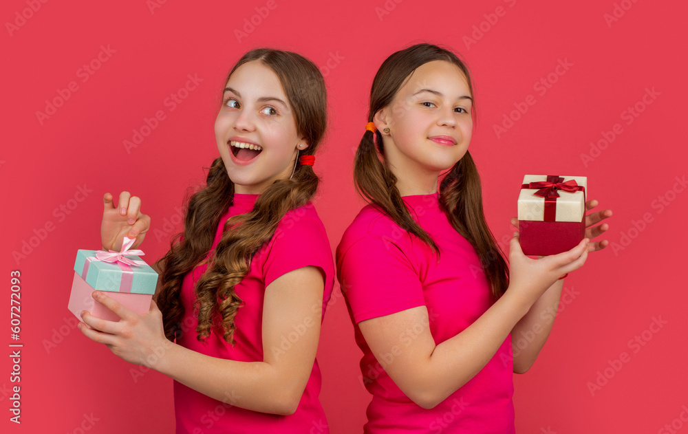 happy kids with present boxes on red background happy kids with present boxes on red background