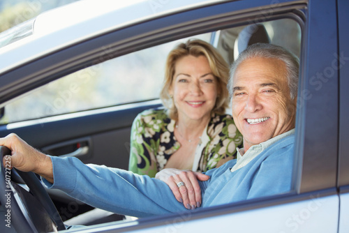 Portrait of happy senior couple in car © KOTO