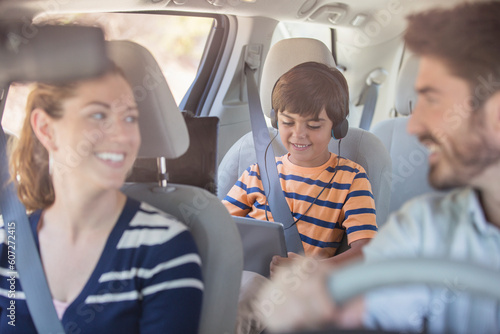Happy family inside car © KOTO