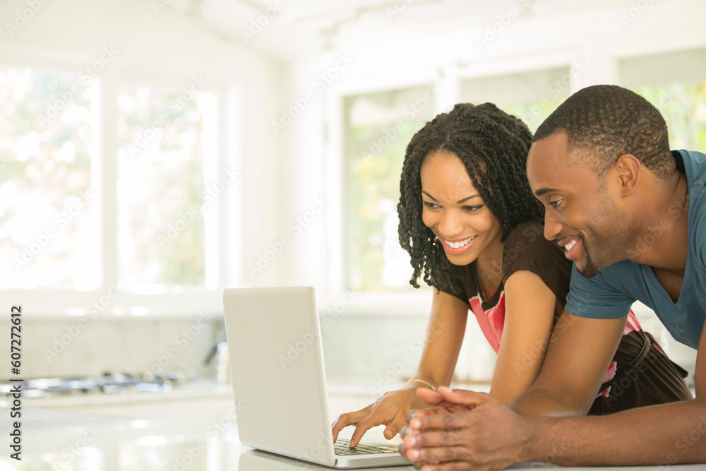 Couple using laptop Couple using laptop