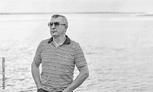 Older man with a sad philosophical mood. The concept of life after 50-60 years, problems and depression. Crisis of middle age