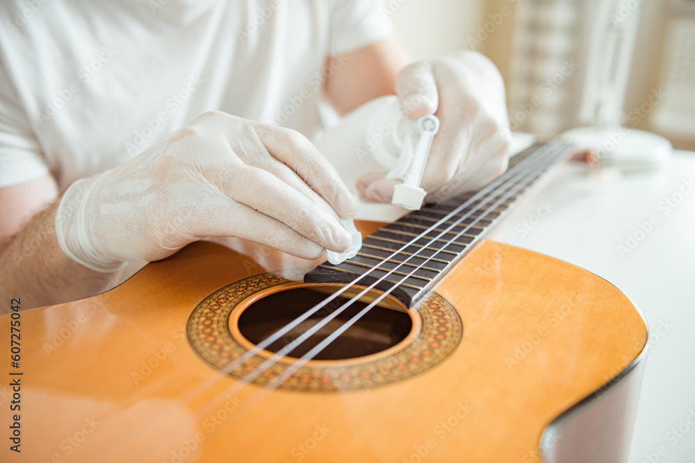 Cleaning guitar fretboard with wet wipes made for guitar Stock Photo Adobe Stock