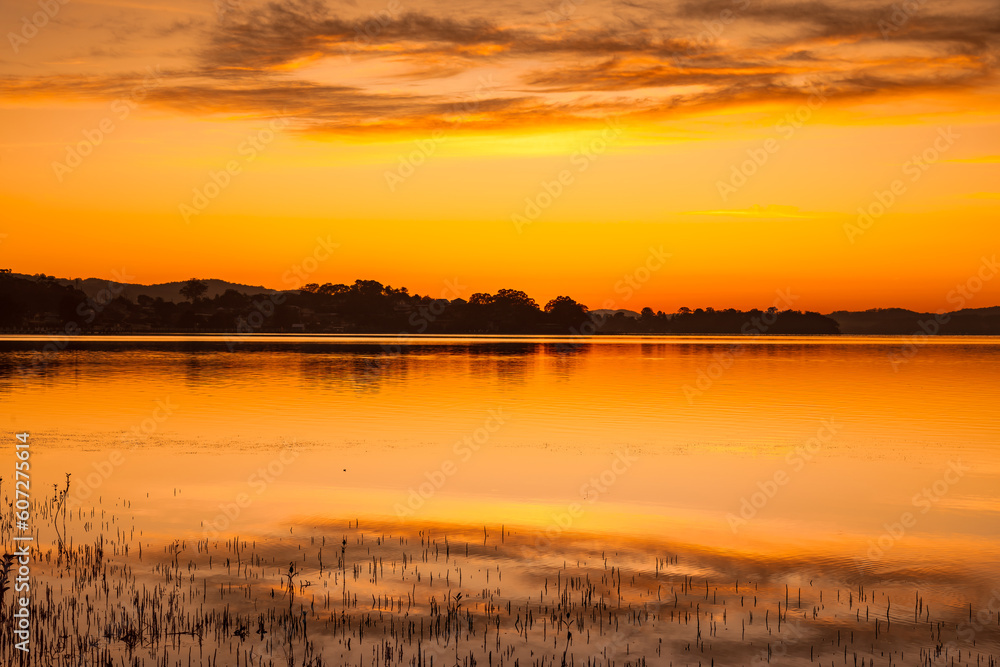 Shades of orange sunrise waterscape Shades of orange sunrise waterscape