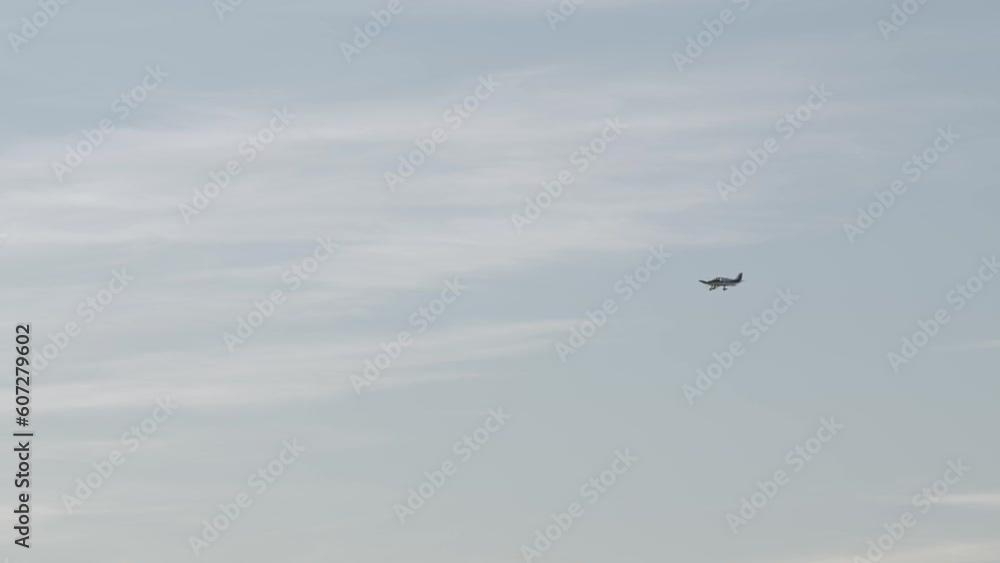 Airplane Flying Against Cloudy Sky In Arcachon, France. wide Airplane Flying Against Cloudy Sky In Arcachon, France. wide