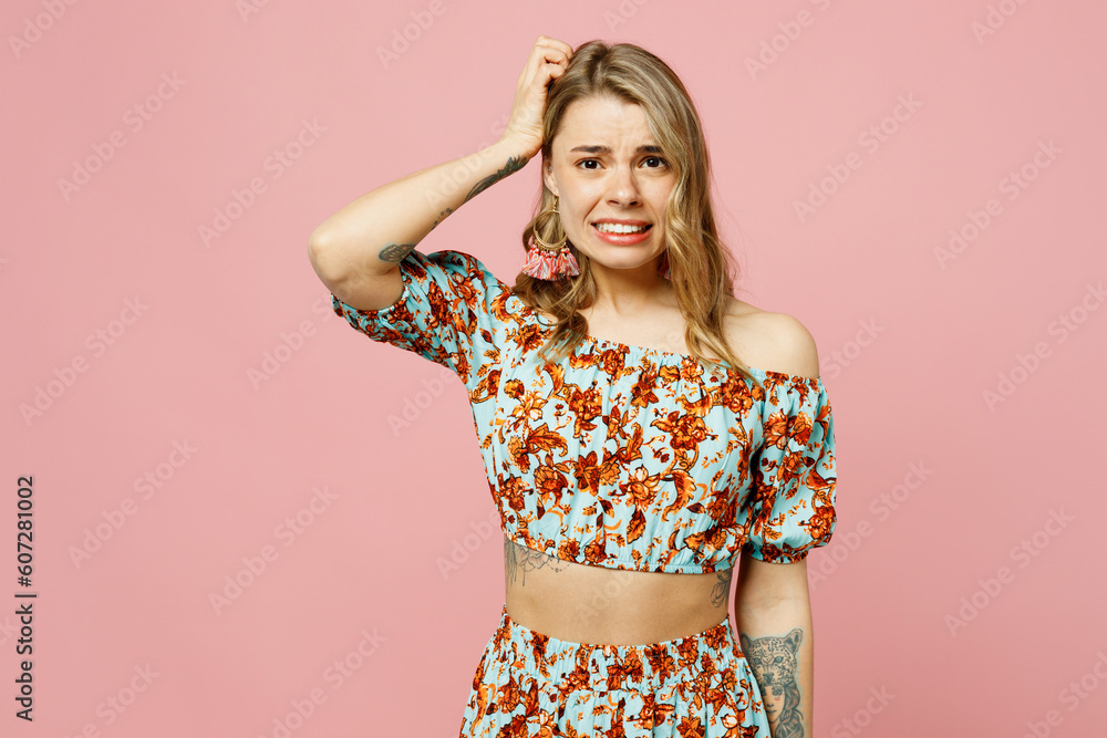 Young sad mistaken unhappy blonde caucasian woman wear summer casual clothes look camera scratch hold head say oops isolated on plain pastel light pink background studio portrait. Lifestyle concept. Young sad mistaken unhappy blonde caucasian woman wear summer casual clothes look camera scratch hold head say oops isolated on plain pastel light pink background studio portrait. Lifestyle concept.
