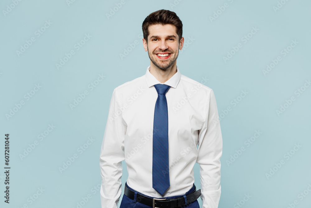 Young smiling happy fun successful employee business man corporate lawyer wearing classic formal shirt tie working in office look camera isolated on plain pastel light blue background studio portrait. Young smiling happy fun successful employee business man corporate lawyer wearing classic formal shirt tie working in office look camera isolated on plain pastel light blue background studio portrait.
