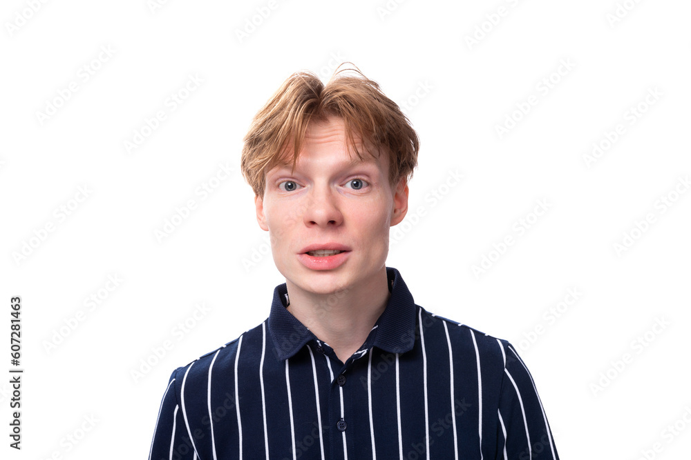 close-up portrait of a stylish handsome young blond man keeping a secret on a white background close-up portrait of a stylish handsome young blond man keeping a secret on a white background