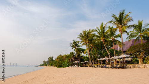 Beach of Bangsaray Pattaya Thailand at sunset with beach chairs and sunbeds