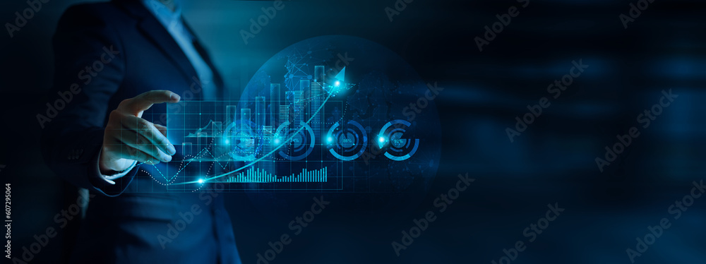Fototapeta premium Businessman analyzing finance business data graph, Stock investment and calculating financial data for investment growth target and company balance sheet, Strategy for perceptive business decision.