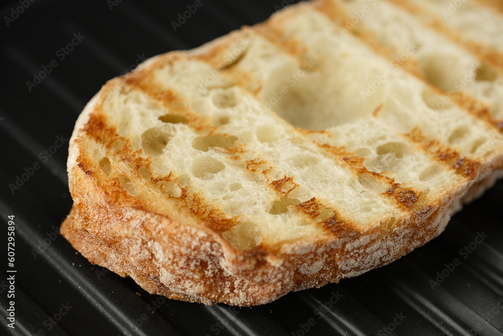 Fresh ciabatta bread on grill.
Ciabatta bread holes Fresh ciabatta bread on grill.
Ciabatta bread holes