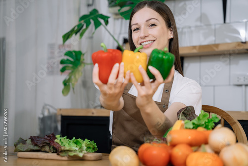 Woman preparing healthy food in her kitchen.