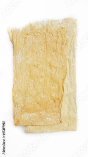 Beancurd tofu sheet or kembang tahu isolated on white background. Beancurd japanese, chinese and indonesia cuisine ingredient. Healthy food