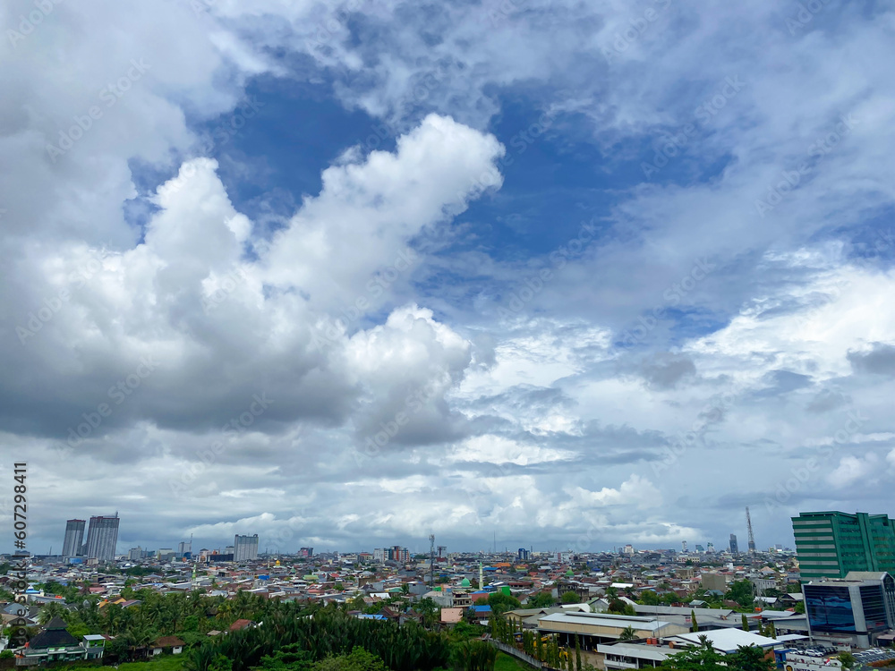 Makassar city view with cloudy sky. top of view makassar city Makassar city view with cloudy sky. top of view makassar city
