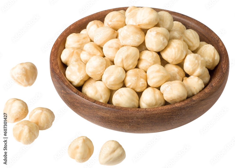 Hazelnuts in the wooden bowl, isolated on the white background. Hazelnuts in the wooden bowl, isolated on the white background.