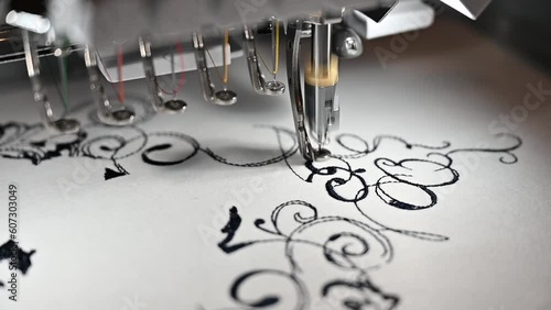 4K: Embroidery machines create a textile pattern on cloth, textile and Garment Manufacturers photo