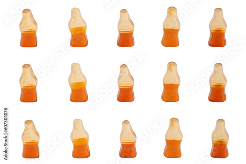 Cola flavored gummy jellies in the shape of cola bottles isolated over transparent background.