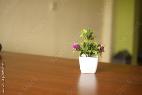 Plastic flower at the table