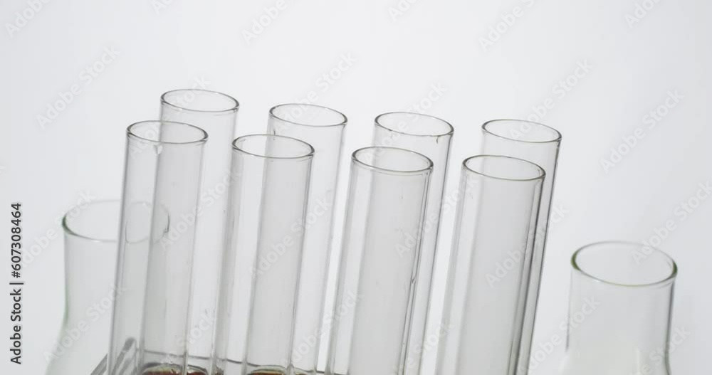 Scientist chemist dripping engine oil from pipette into test tube
Scientist chemist dripping engine oil from pipette into test tube
