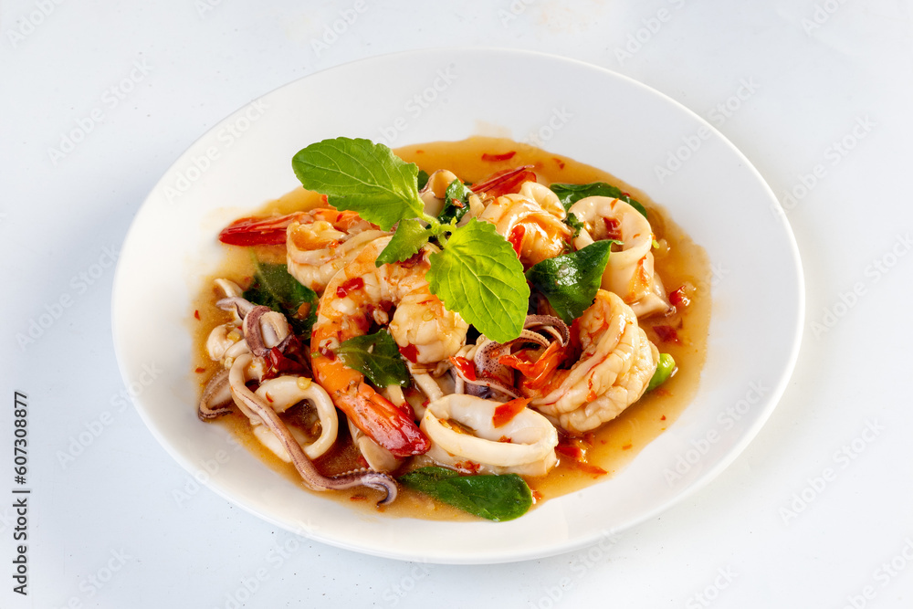 Stir Fried Basil with Seafood isolated on white background Stir Fried Basil with Seafood isolated on white background