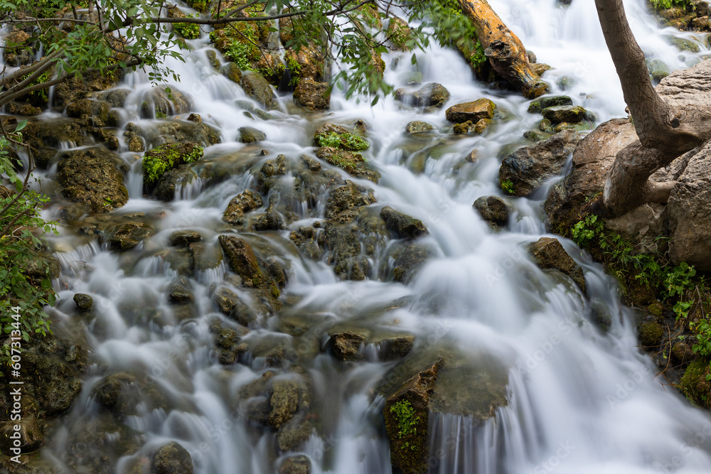 iran waterfall through rocks in a forrest detail iran waterfall through rocks in a forrest detail