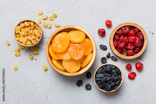 Fototapeta Naklejka Na Ścianę i Meble -  Bowl with different dried fruits on table background, top view. Healthy lifestyle with copy space