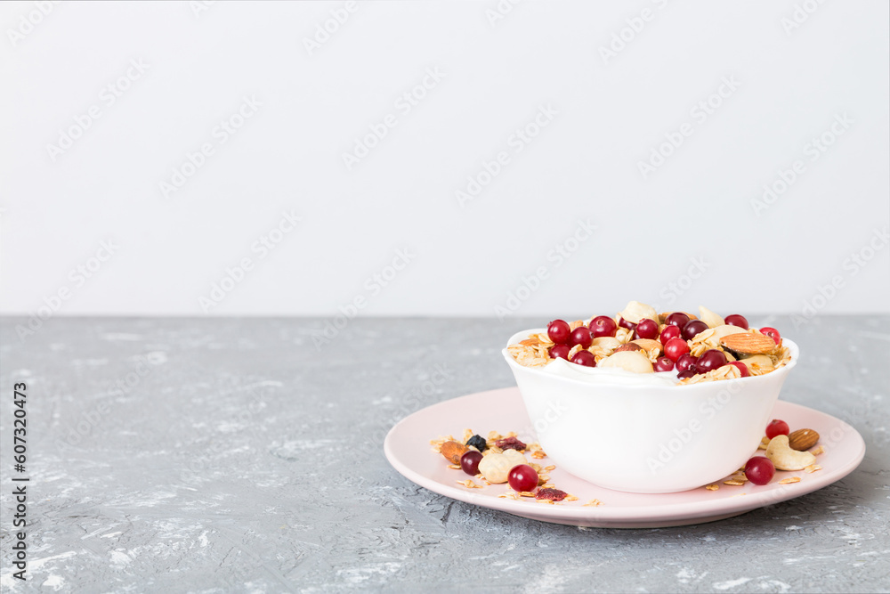 Healthy breakfast food with granola, yogurt, fruits and nuts. Dessert parfait with dried fruits for breakfast Healthy breakfast food with granola, yogurt, fruits and nuts. Dessert parfait with dried fruits for breakfast
