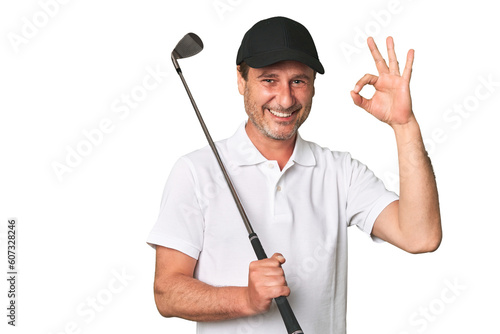Middle aged golfer man excited keeping ok gesture on eye.