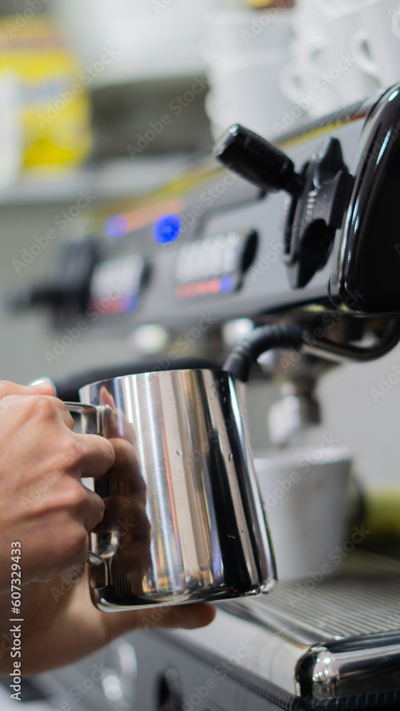 young barista worker preparing coffee in a colombian coffee shop young barista worker preparing coffee in a colombian coffee shop