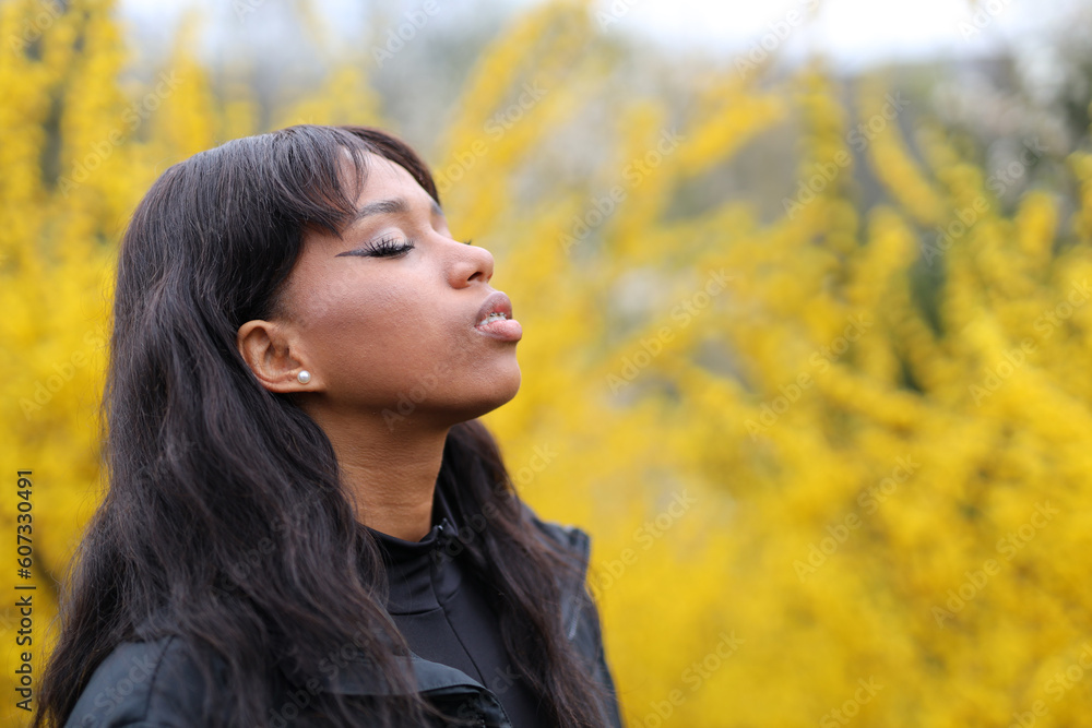 A dark-skinned woman went out to get some fresh air in the park. A dark-skinned woman went out to get some fresh air in the park.