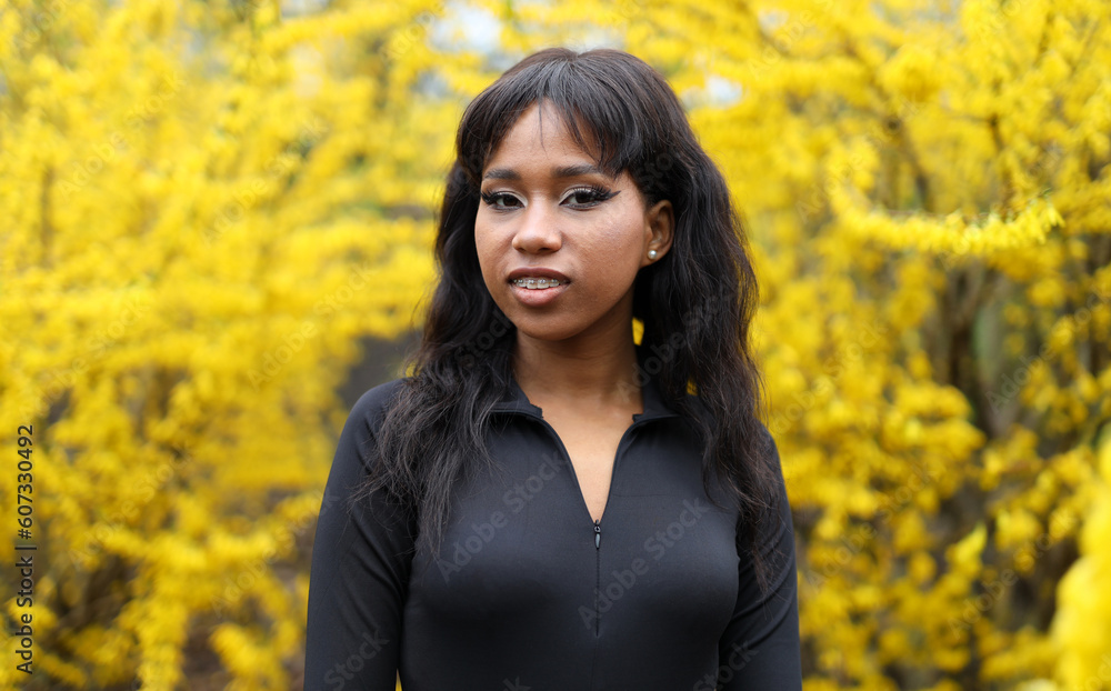 Portrait of a dark-skinned girl outdoors in the park. Portrait of a dark-skinned girl outdoors in the park.