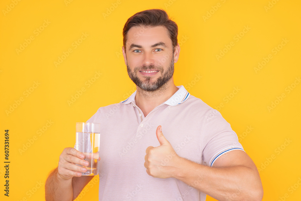 Man drinking water. Portrait of happy smiling man with glass of fresh water. Thirsty guy. Refreshing. Water balance. Portrait of man drinking pure still water. Man drinking water. Portrait of happy smiling man with glass of fresh water. Thirsty guy. Refreshing. Water balance. Portrait of man drinking pure still water.