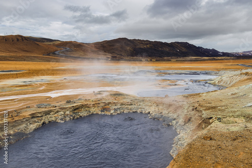 Beautiful Iceland landscape with surreal Namafjall geothermal area. Hverir. Steam, sulfur, boiling mud, out of this world. photo